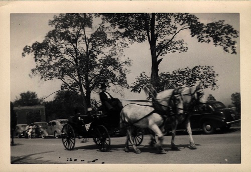Seward Family Carriage on Main Street with with formally attired driver: George Dean; passengers: Stanley Moduski & Thomas Howell. 100th Hambletonian Anniversary Parade, Thursday May 5, 1949. chs-003494